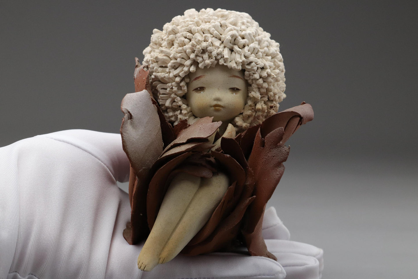 Ceramic Art Doll by Shoko Takeuchi Handcrafted Figurine With Curly Hair in Abstract Floral Form for Artistic Display or Interior Decoration