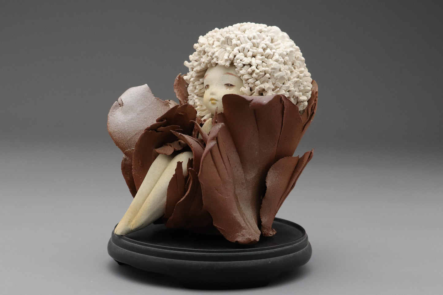 Ceramic Art Doll by Shoko Takeuchi Handcrafted Figurine With Curly Hair in Abstract Floral Form for Artistic Display or Interior Decoration