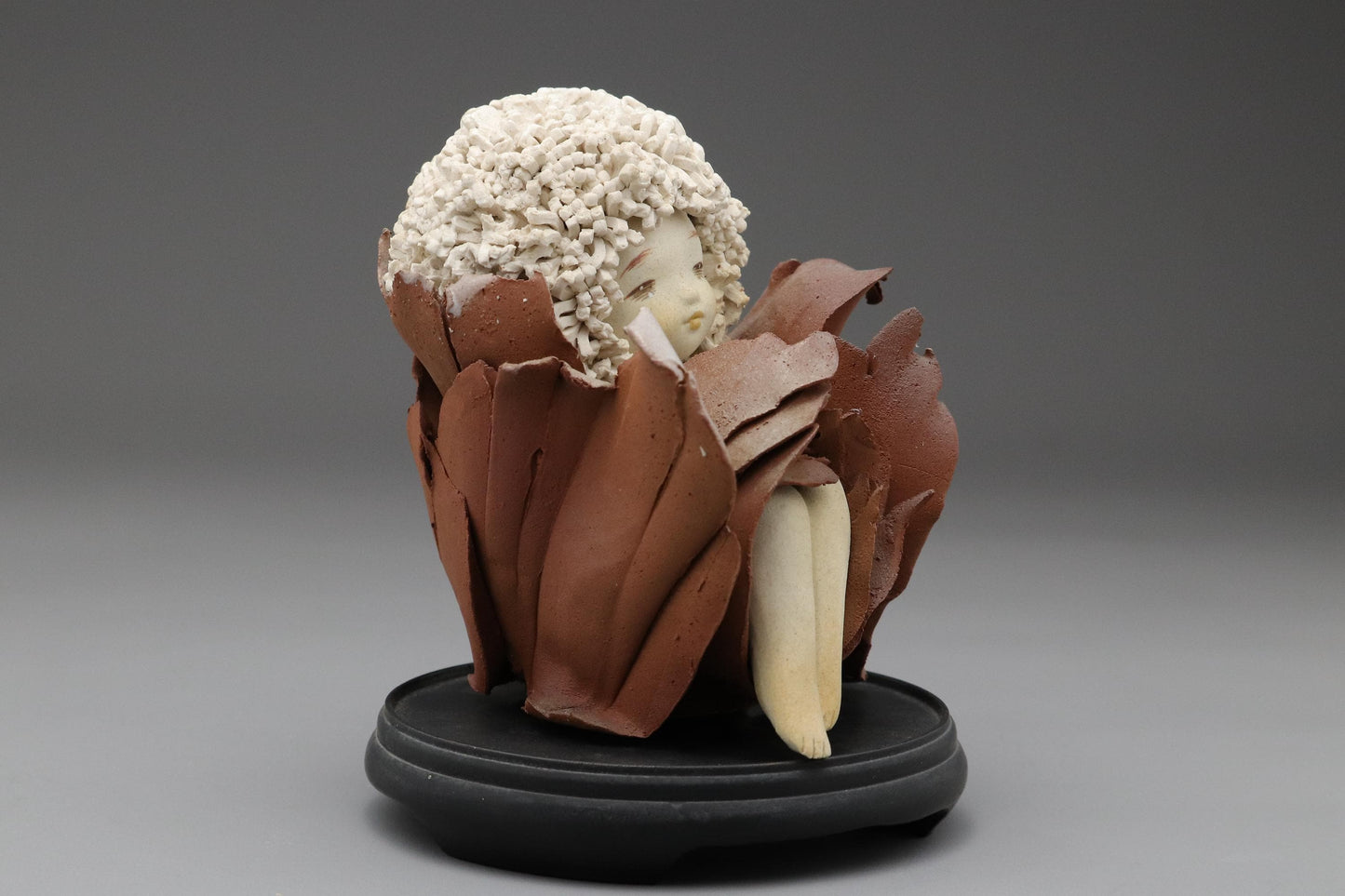 Ceramic Art Doll by Shoko Takeuchi Handcrafted Figurine With Curly Hair in Abstract Floral Form for Artistic Display or Interior Decoration