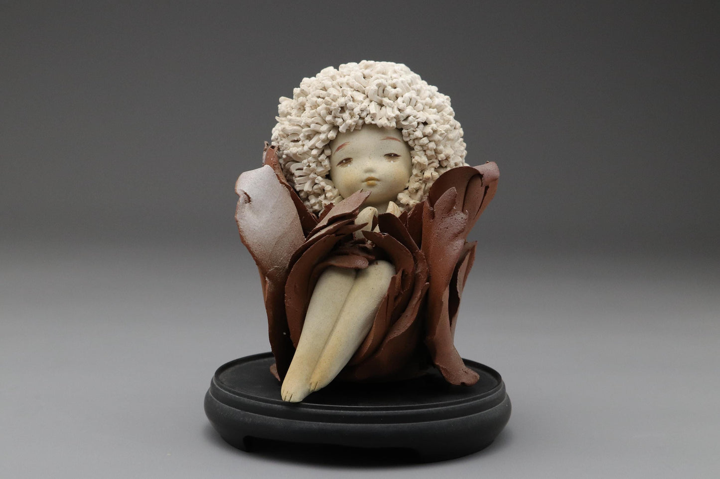 Ceramic Art Doll by Shoko Takeuchi Handcrafted Figurine With Curly Hair in Abstract Floral Form for Artistic Display or Interior Decoration