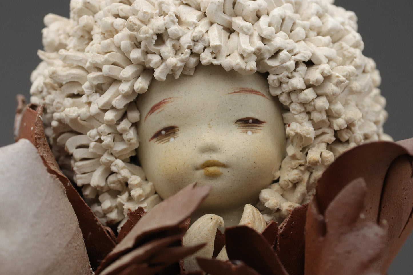 Ceramic Art Doll by Shoko Takeuchi Handcrafted Figurine With Curly Hair in Abstract Floral Form for Artistic Display or Interior Decoration